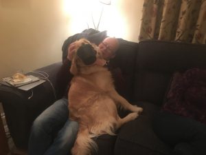 Alex playing with Monty on the settee