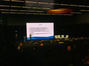 He is that tiny dot on the left hand side of the screen thingy. Hardly worth him turning up in my view! And 2,500 people turned up to listen to him ... I'm only one dog and I find him boring enough!